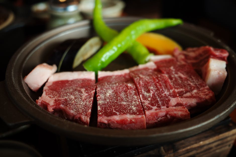 Close-up of marbled Wagyu beef with green peppers in Kyoto, Japan