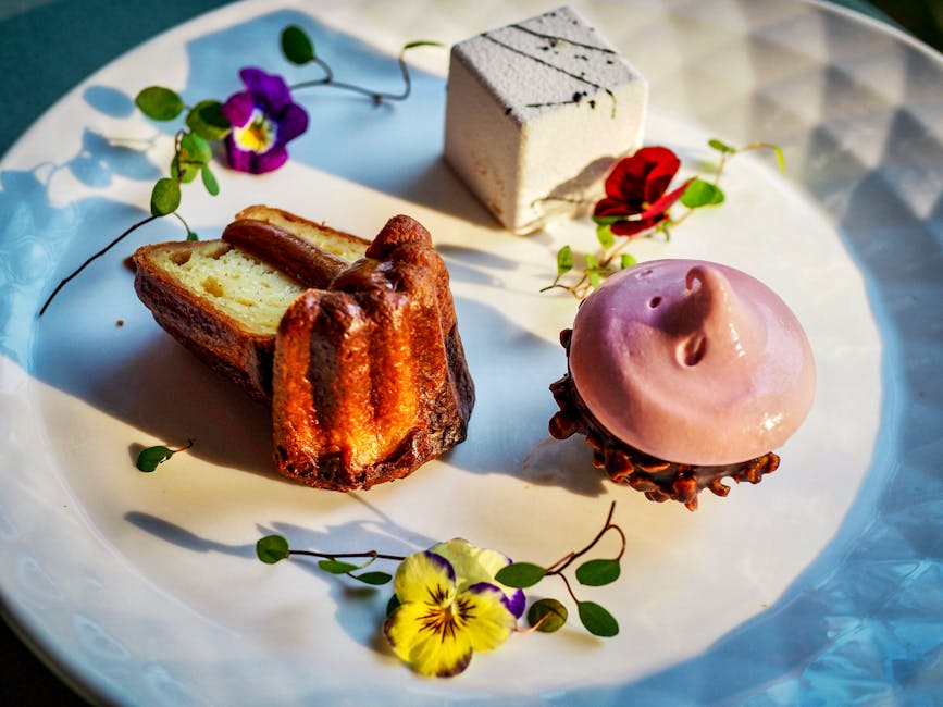 Gourmet dessert assortment on a decorative plate with edible flowers